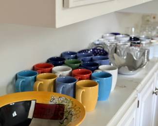 Colorful coffee mugs and bowl