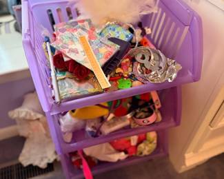 Purple rolling cart with craft supplies
