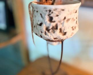 Speckled ceramic planter on stand