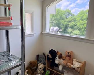 Corner with stuffed animals and shelving