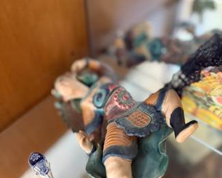 Asian costumed figure statue