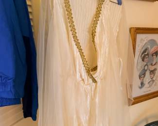 Vintage clothing and accessories on hangers