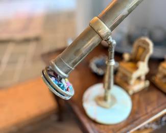 Vintage brass telescope on stand