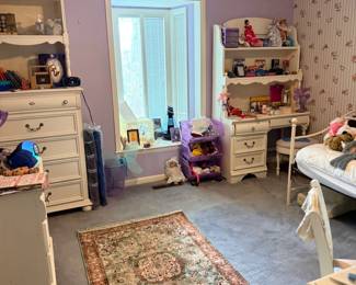 Bedroom with white furniture and rug