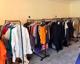 Racks of hanging clothing
