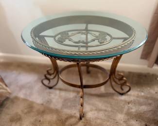 Round glass-top iron side table