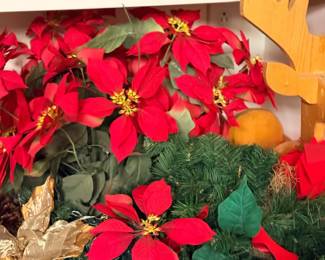 Faux poinsettias and Christmas greenery