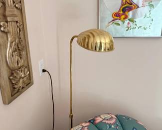 Brass floor lamp and wall decor