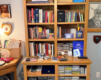 Oak bookcase with books and CDs