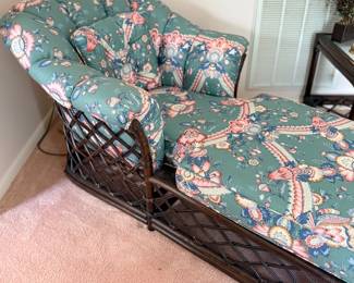 Rattan chaise lounge with floral upholstery
