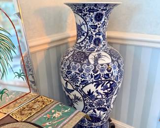 Large blue and white floor vase on stand