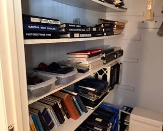 Closet shelves of books and manuals