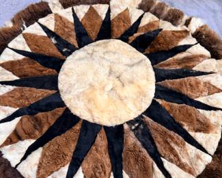 Round patchwork fur rug, sunburst pattern