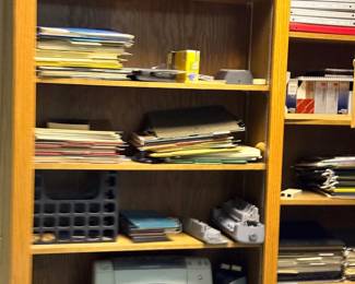 Wood shelving with office supplies
