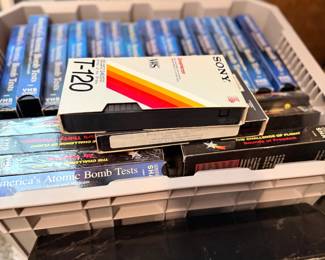 Collection of VHS tapes and CDs