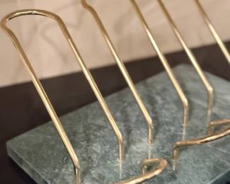 Brass toast rack on marble
