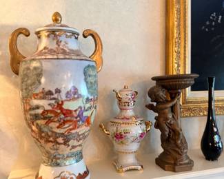 Mantel with lidded urns and decorative vases