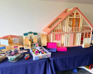 Large wooden dollhouse with toys