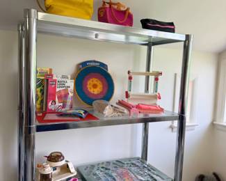 Shelving with games, handbags and toys