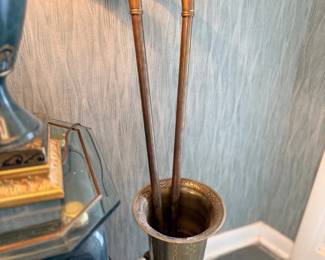 Antique carved walking canes in umbrella stand