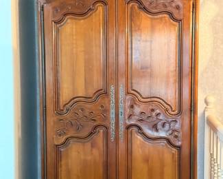 Carved French armoire wardrobe