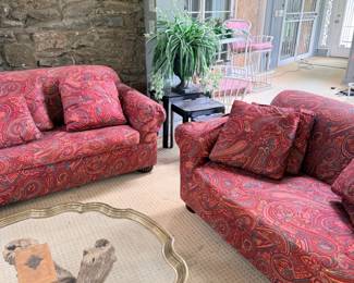Red upholstered sofa and loveseat set