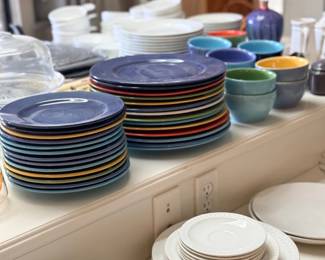 Stacks of colorful and white plates