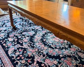 Dining room with wood table and Oriental rug