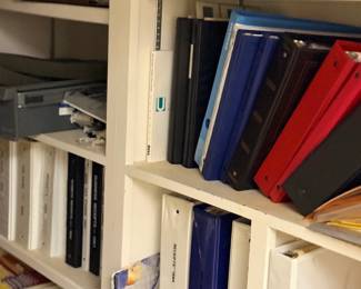 Shelf of binders and books