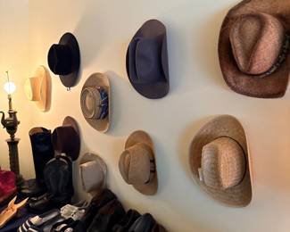 Wall of fedoras and cowboy hats