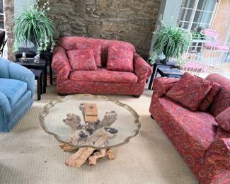 Red sofa set and driftwood coffee table
