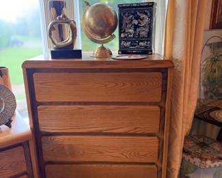 Oak chest of drawers with globe on top