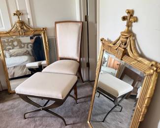 Upholstered chair and large gold mirror