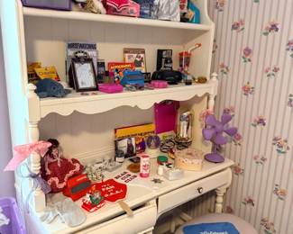 White vanity desk with dolls and stool