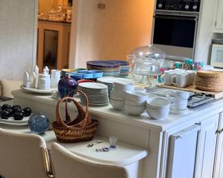 Kitchen island with dishware and glassware
