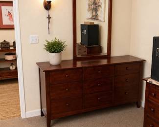 Solid wood dresser with matching mirror in very good condition. Beautifu dark cherry finish with spacious storage drawers. Perfect for bedroom forniture set. $250 OBO