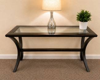 Elegant glass top console table in vera good condition. Modern, dark wood design, perfect for entryway, hallway or living room decor. Clean and well maintaned. $120