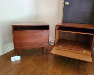 Authentic vintage mid-century  night stands. Set of two. Featuring a drop down door and and an open upper shelf.  23x23x15.