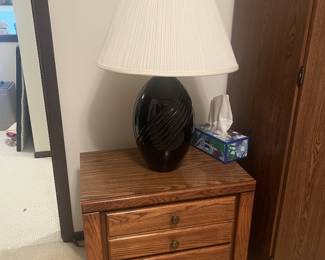 wooden nightstand, lamp