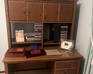 desk, CDs, picture frames, decor