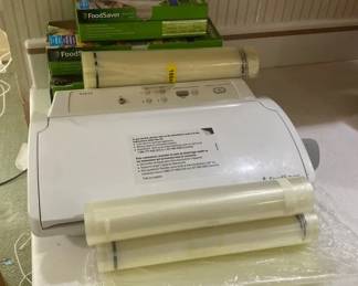 FoodSaver Vacuum Sealer with Boxes and Rolls of FoodSaver Bags