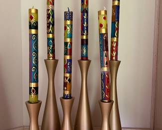 South African “Golden glow” taper candles, $6 each. Large candles holders, $10 each.  Small candle holders, $8