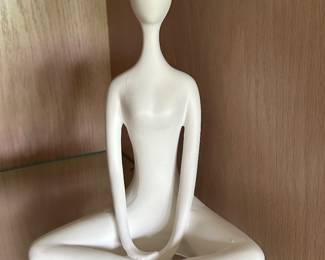 White modern sitting sculpture, $14