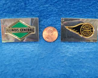 Lot 210. Two sterling silver ingots from "The Great American Railroad Emblems" series. the Illinois Central and the Western Maryland. Total weight of 46.1 grams.