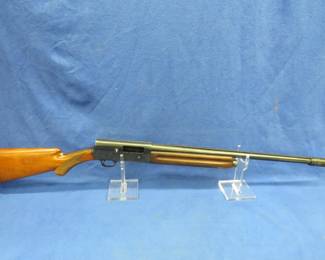 Lot 18. Browning A-5, S/N: 156287; 12-gauge, semi-automatic shotgun with a case. There is worn bluing and a crack in the foregrip.