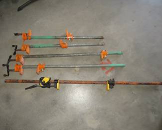 Lot 63. Five pipe clamps. Two 24-inch, two 32-inch, and a 48-inch.