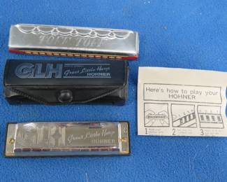 Lot 231. Two Hohner harmonicas: GLH Great Little Harp harmonica ion the key of C with a vinyl case. Sounds great. Toff Toff tremolo 28-hole harmonica made in Germany.