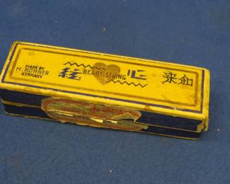 Lot 42. Hohner Heart-String 10-hole diatonic harmonica in the key of C. In the box. Harmonica sounds great. Box in good condition.