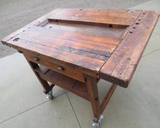 Lot 292. Rolling vintage lacquered shop table. 52'W x 37"H x 36"D. This is nice enough to go into a country kitchen
