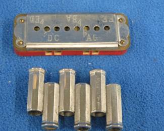 Lot 234. Two pitch pipes: Marsto guitar pitch pipe. Sterling pitch pipe.